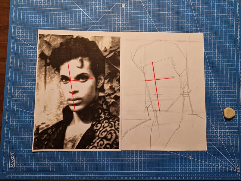 J’ai dessiné l’axe central du visage ainsi que l’axe horizontal au niveau du regard. Ce sont de bons réflexes de construction à adopter dès le départ.